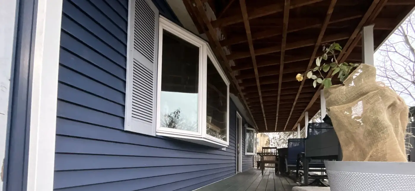 Blue siding beside a porch